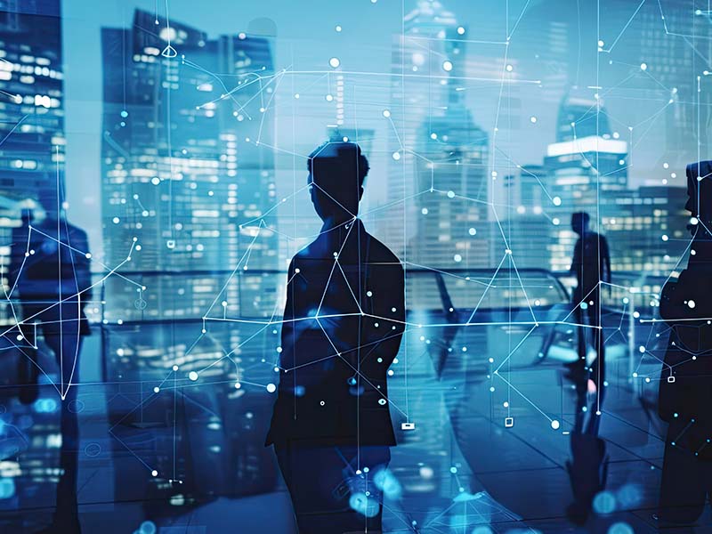 silhouettes-business-professionals-bluetoned-office-with-digital-network-overlay